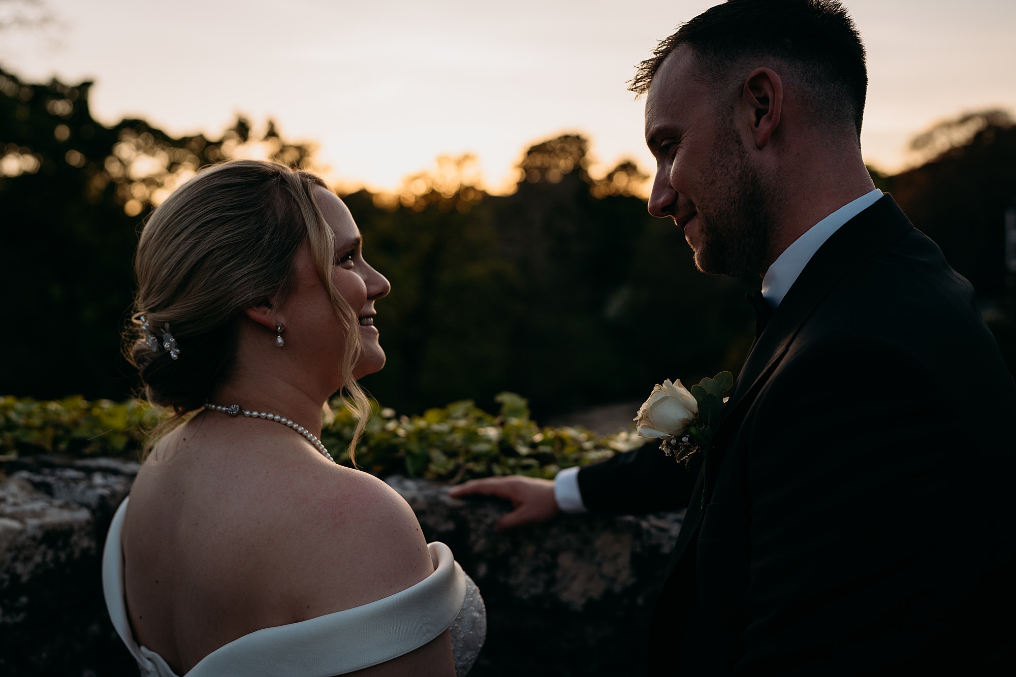 Couple look at each other completely relaxed. Brig O'Doon House Hotel wedding photography