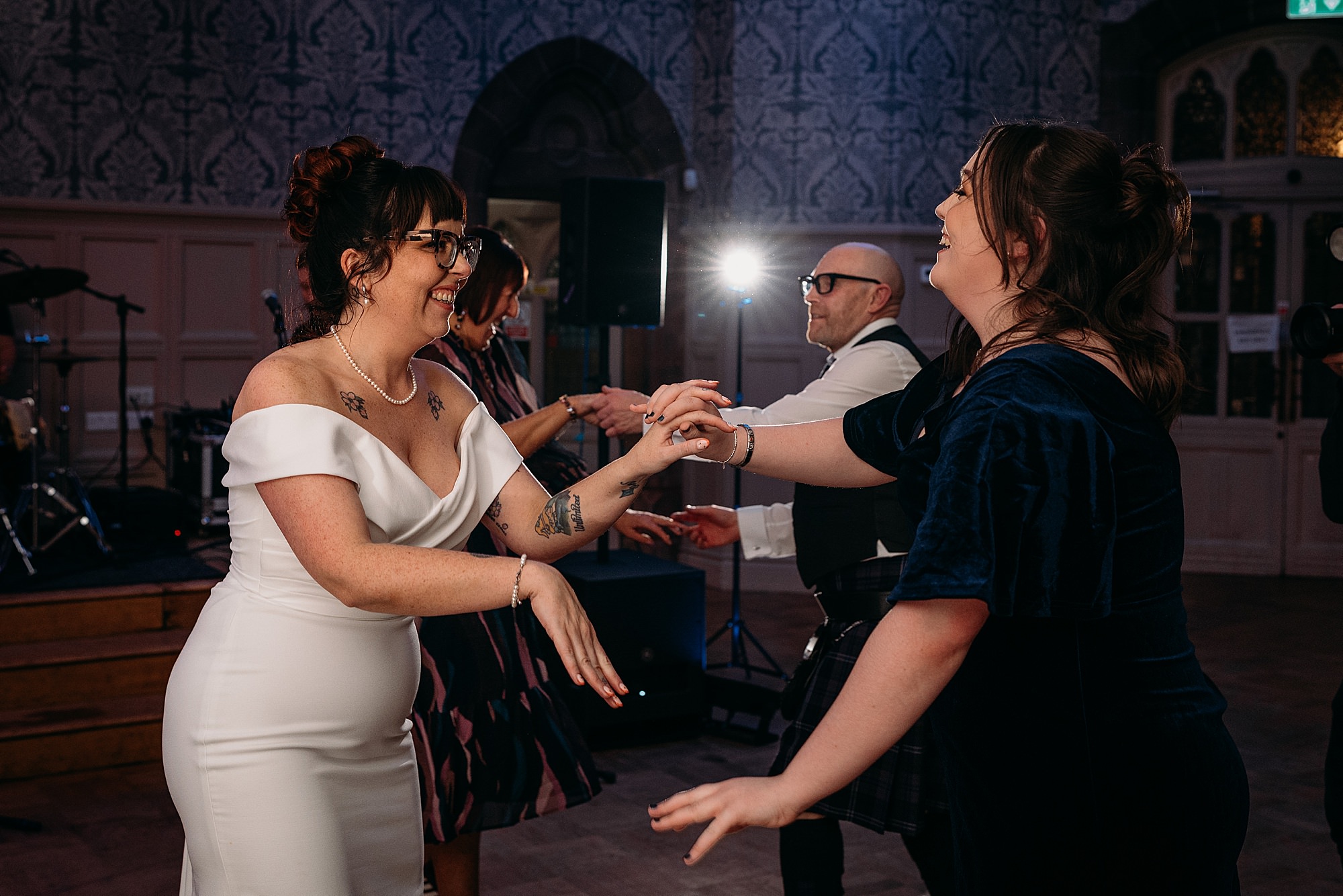 Bride dances with niece at Coats Paisley Twilight Wedding party