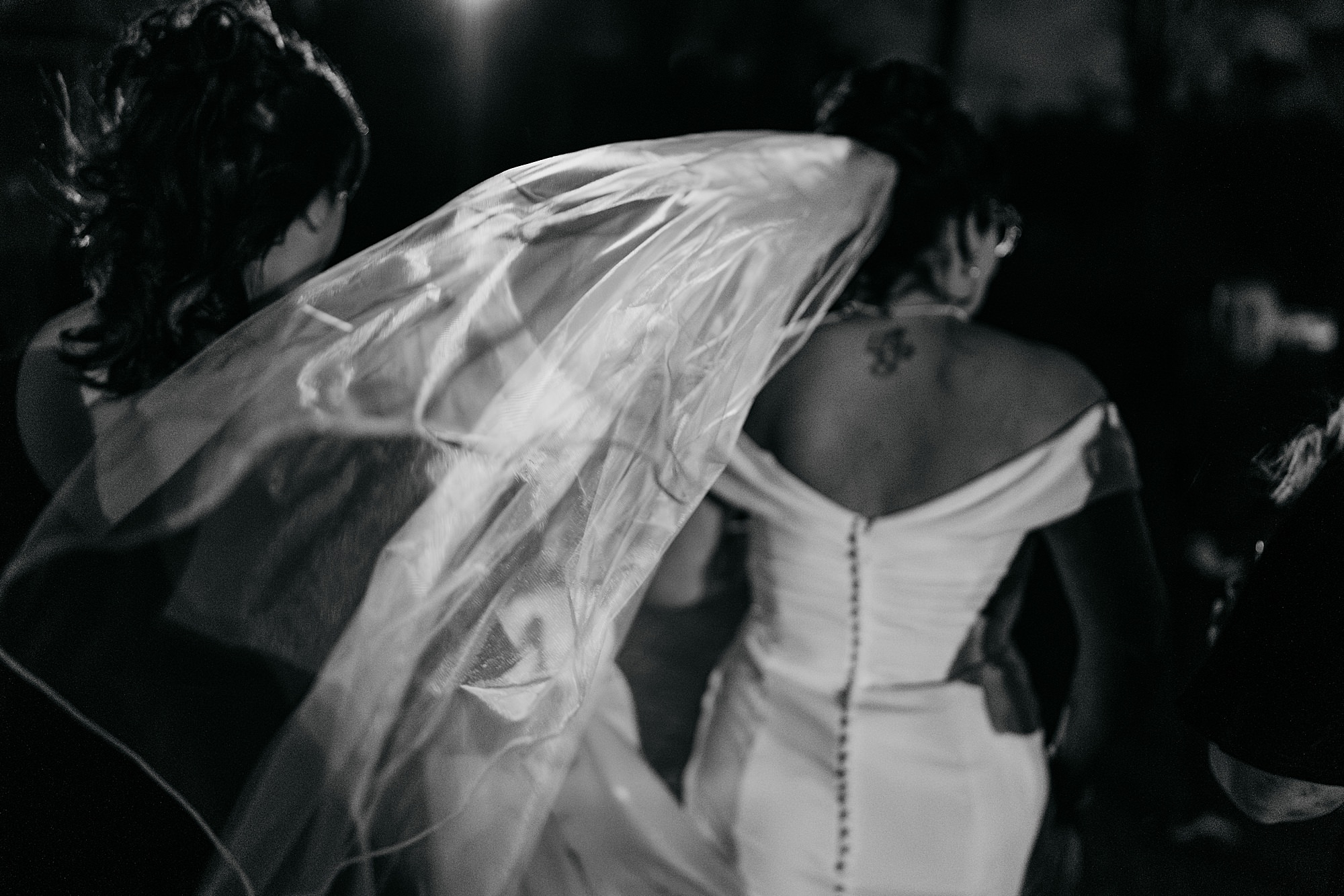 brides veil blows in wild wind at her Coats Paisley Twilight Wedding