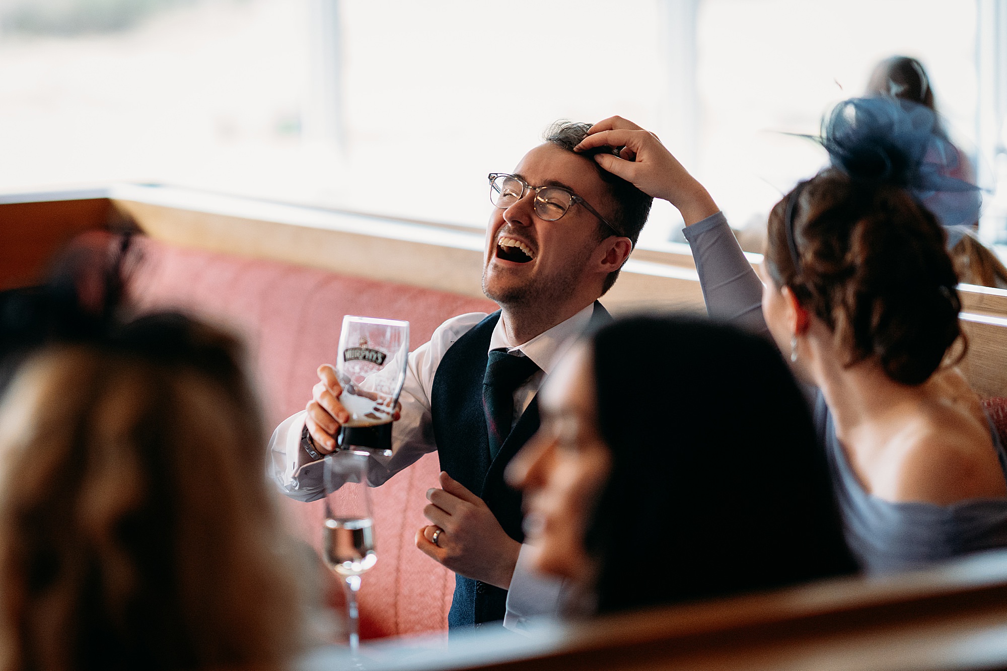 Guests laughing at a Kingshouse Hotel Glencoe wedding. 