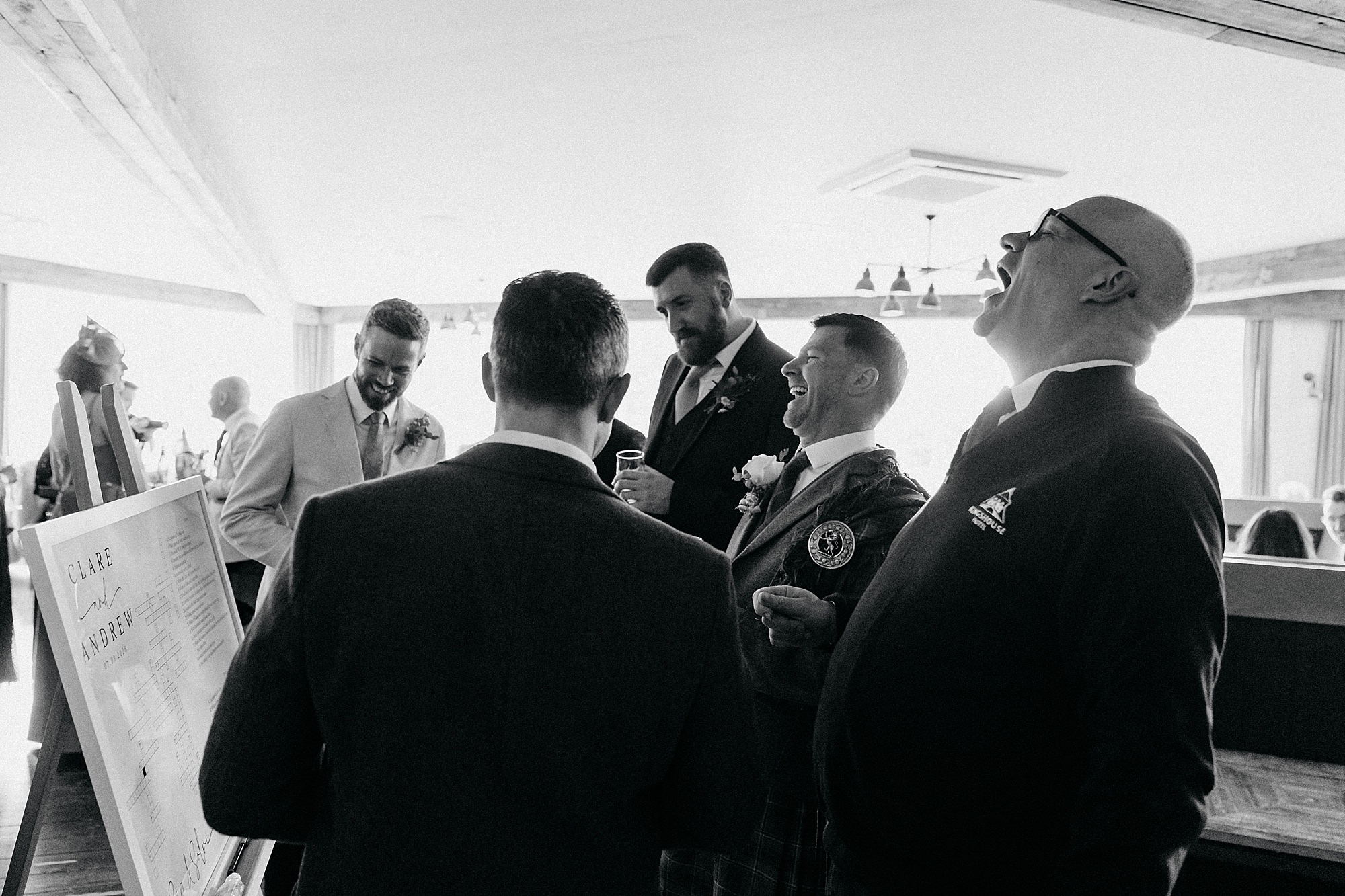 Guests laughing at Kingshouse Hotel Glencoe wedding reception. 
