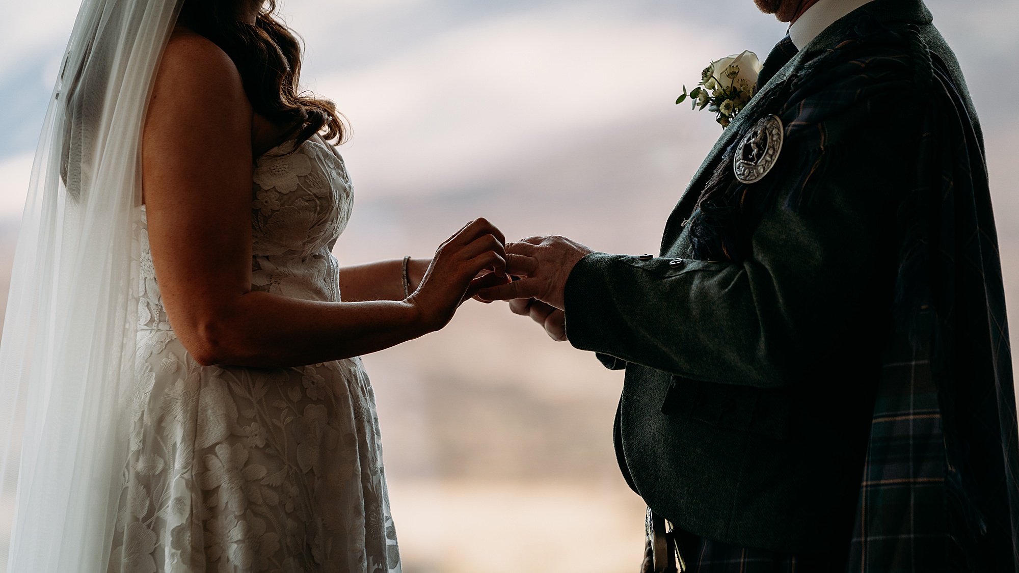 Clare and Andrew exchanging rings at their Kingshouse Hotel Glencoe wedding 